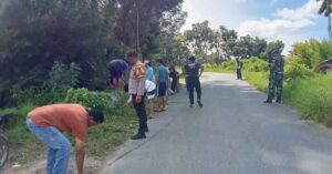 Bhabinkamtibmas Polsek Munte Hadiri Gotong Royong Bersama Warga, Wujudkan Lingkungan Bersih dan Kebersamaan